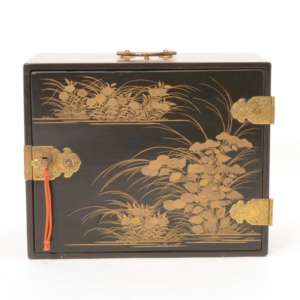 A Gilt-Painted and Black Lacquered Kodansu, Edo Period: A Gilt-Painted and Black Lacquered Kodansu Of rectangular outline with a hinged cover and five drawers, all decorated with autumnal flowers, with gilt-metal fixtures. Edo Period {8 3/4 x 11 x 7 inches