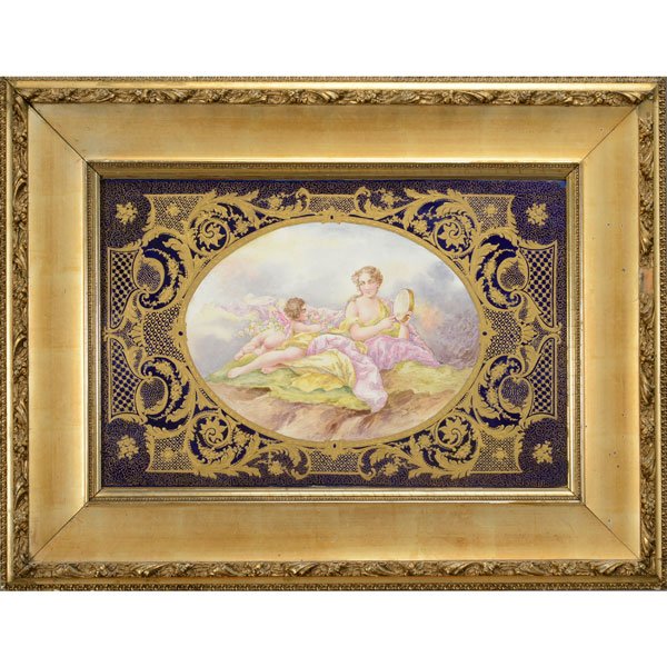 Svres Style Porcelain Plaque of Venus: Svres Style Porcelain Plaque of Venus, The rectangular form centering an oval vignette of reclining Cupid and Venus holding a mirror, draped in yellow and pink, on green grassy ground, reserved agains