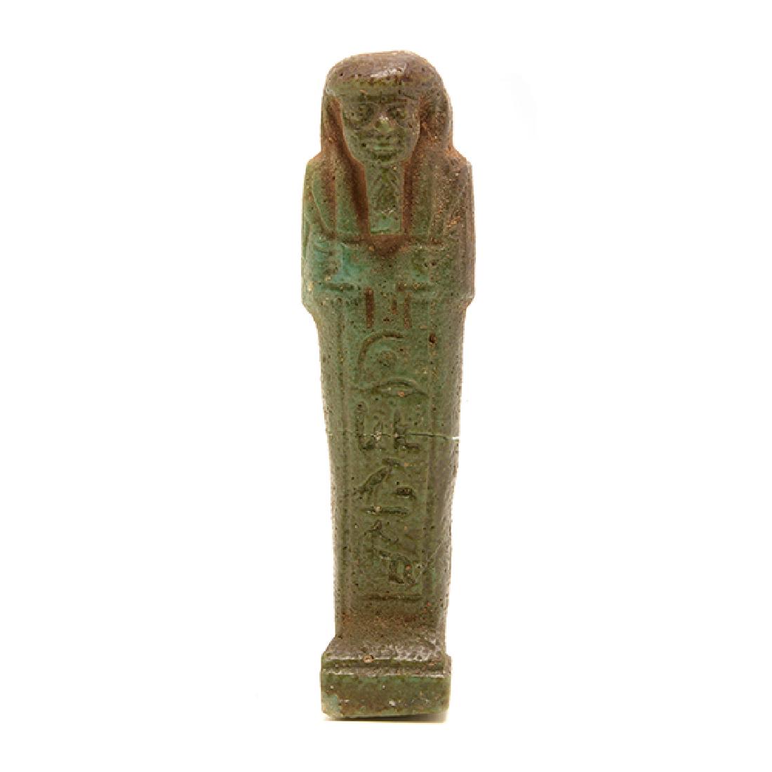 Egyptian Faience Ushabati with Hieroglyphics on Obverse: Egyptian Faience Ushabati with Hieroglyphics on Obverse and Reverse, Ushbati has rich brown and green glaze with deep incised facial features and hieroglyphics, Late Kingdom (1200-1075 B.C.) {Height 4