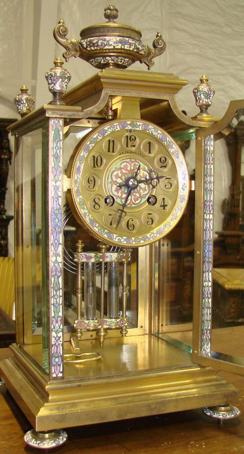 19th c Bronze & Enamel Carriage Clock with Urn Cre: 19th c Bronze & Enamel Carriage Clock with Urn Crest and Mercury Pendulum. 17 1/2"h x 9"w x 8"d in excellent original condition Face of Clock Stamped "J.E Caldwell &CO. Philadelphia