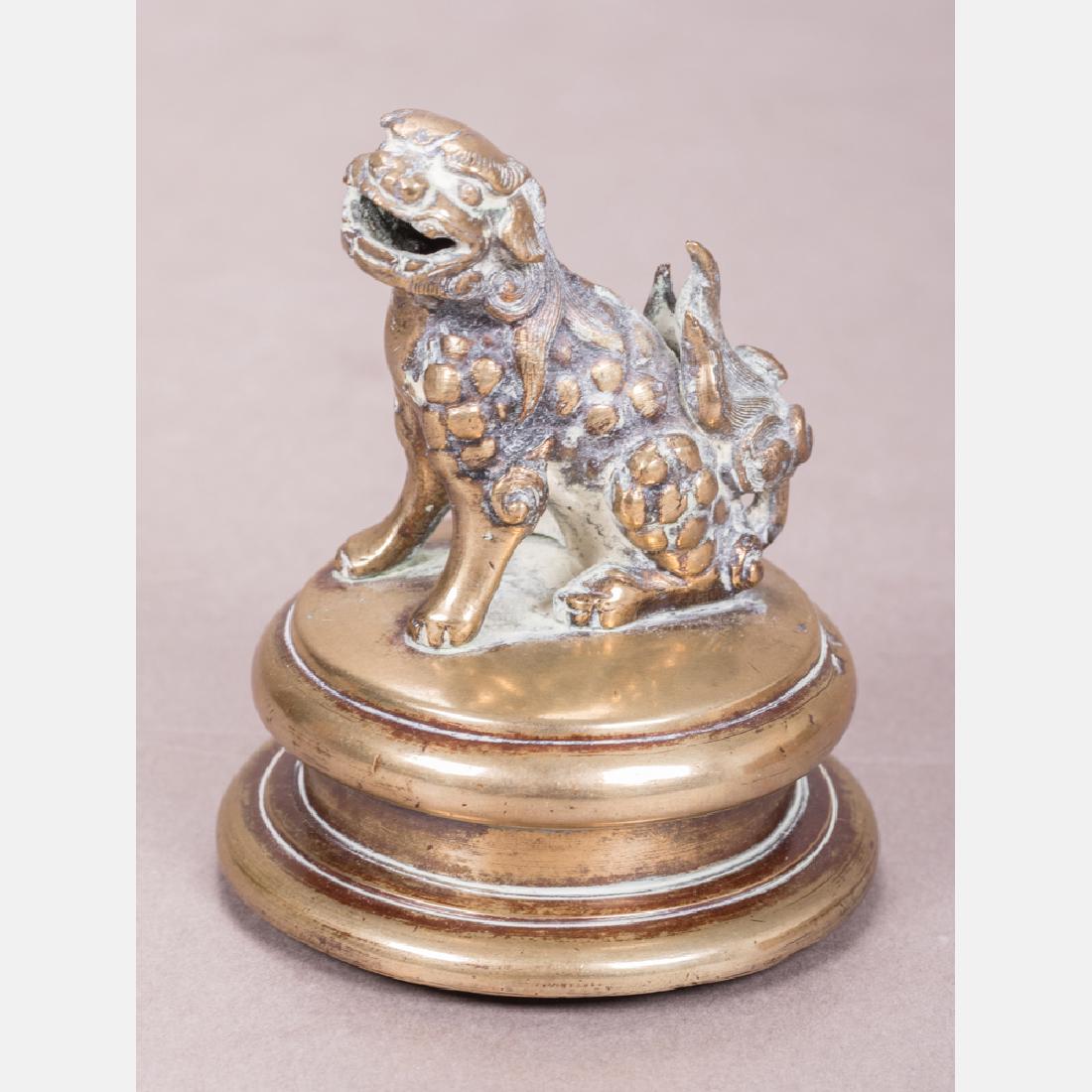 A Chinese Bronze Foo Dog on Stand, 19th Century. (1 of 4)