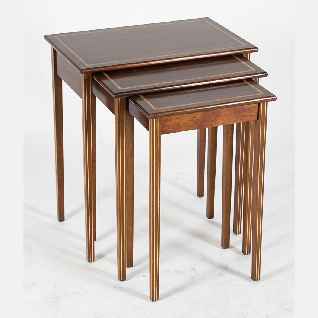 A Set of Three Federal Style Mahogany Nesting Tables,: A Set of Three Federal Style Mahogany Nesting Tables, 20th Century, Having inlay decoration. Largest dimensions: h: 25 x w: 22 x d: 14 in.