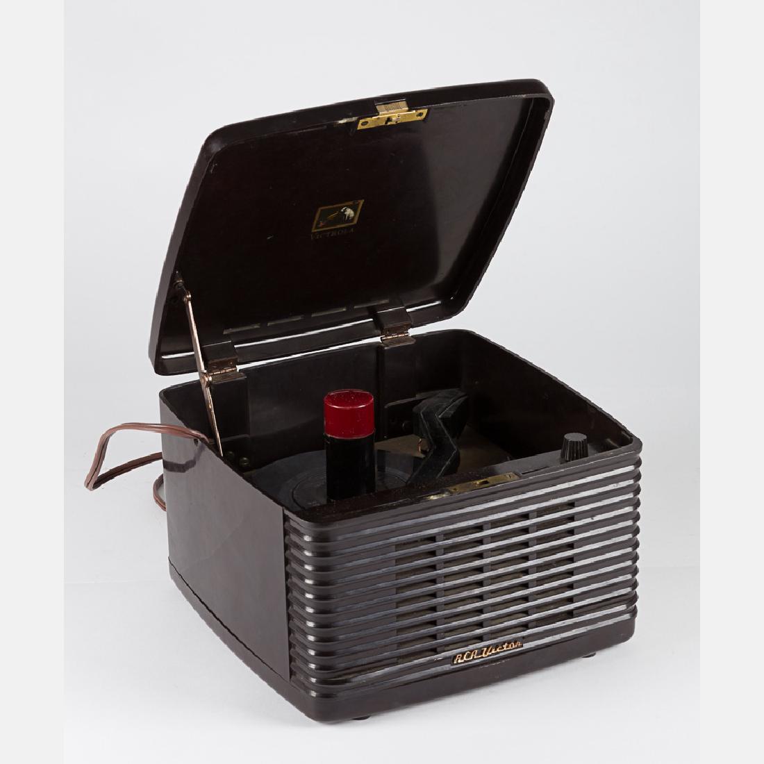 A Vintage RCA Victor Bakelite Portable Record Player,: A Vintage RCA Victor Bakelite Portable Record Player, 20th Century, Together with an Elvis Presley 45-Record, titled 'Bosa Nova Baby'. H: 7 1/2 W: 11 D: 11 1/2 in.
