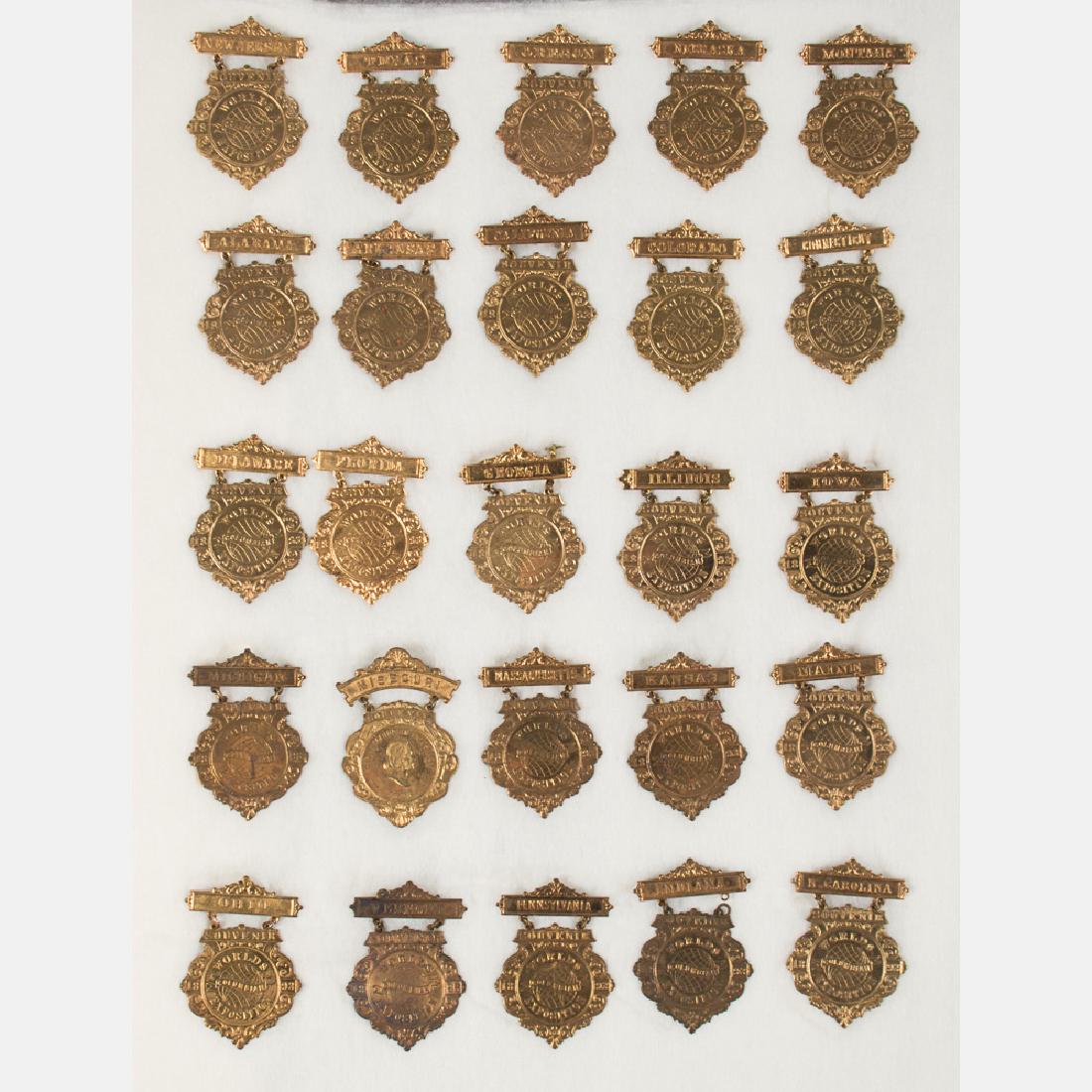 A Collection of Twenty Gilt Plated State Badges from (1 of 3)