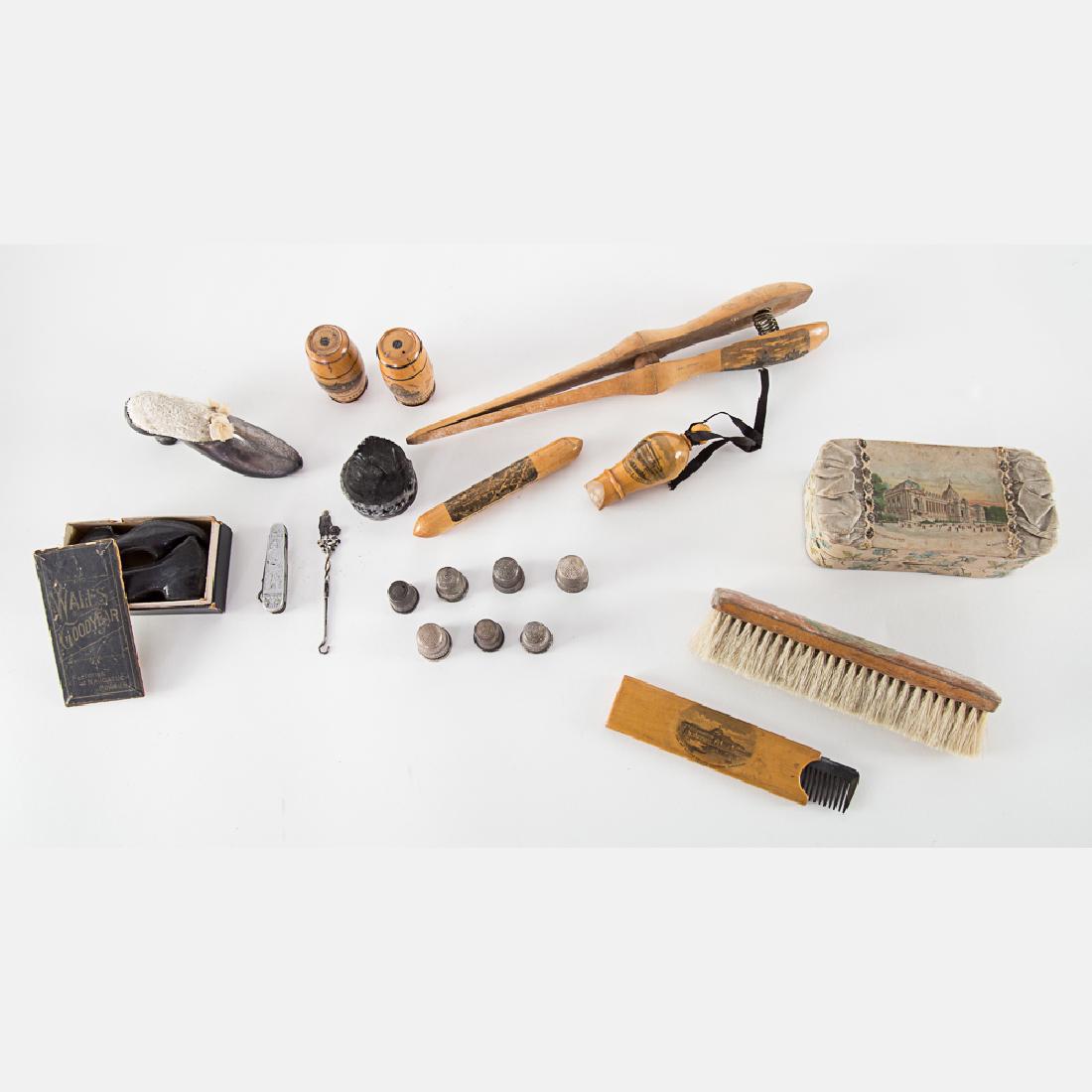 A Miscellaneous Collection of Wooden Transfer Souvenirs: A Miscellaneous Collection of Wooden Transfer Souvenirs from the World's Columbian Exposition, Chicago, 1893, Including a glove stretcher, whistle, comb, brush, and needle cases, seven silvered metal
