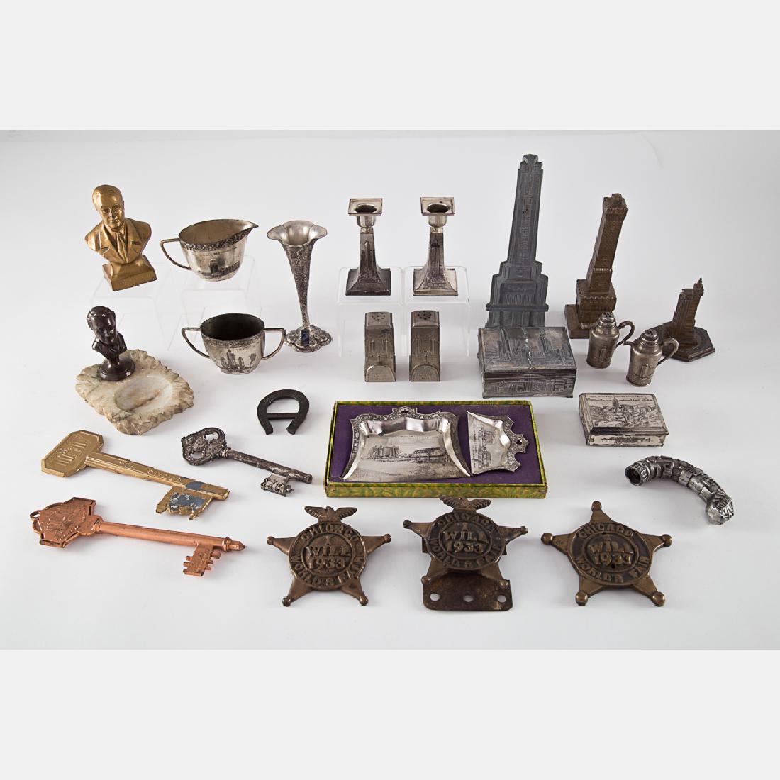 A Collection of Twenty-Five Cast Metal Souvenirs from (1 of 9)