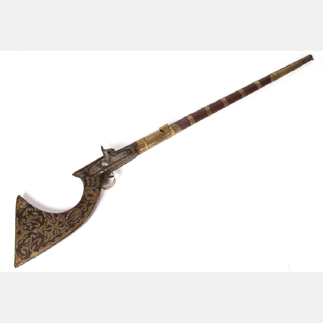 A Middle Eastern Percussion Rifle, 19th Century,: A Middle Eastern Percussion Rifle, 19th Century, The octagonal barrel with brass banding, crude British crown mark on lock plate. Action and hammer in working order. Full stock with brass decoration w