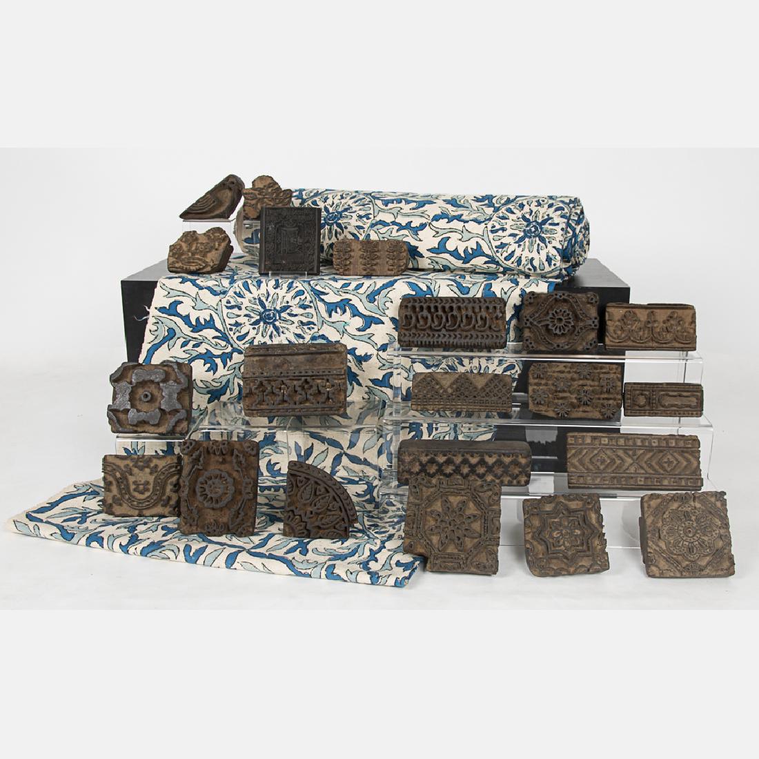 A Collection of Indonesian Textile Block Printing: A Collection of Indonesian Textile Block Printing Stamps, 20th Century, Together with a bolt of woven cotton fabric.