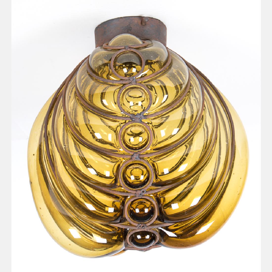 A Persian Blown Glass and Metal Light Fixture, 20th: A Persian Blown Glass and Metal Light Fixture, 20th Century.