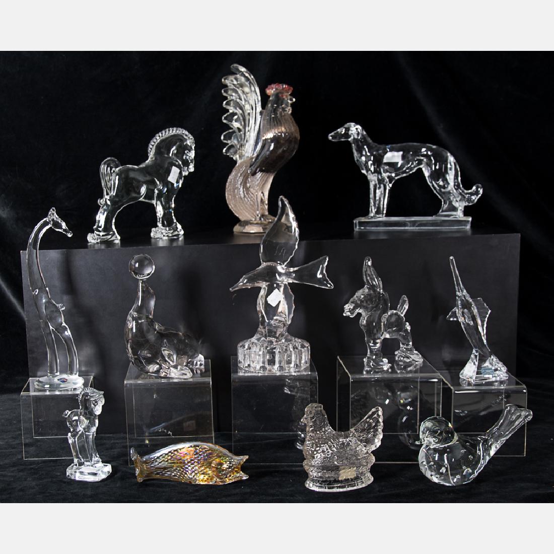 A Collection of Molded and Pressed, Clear and Colored: A Collection of Molded and Pressed, Clear and Colored Glass Animal Form Figurines by Various Makers, 20th Century Including pieces by Heisey's, McKee Glass Co., Jim Davis, Cambridge Glass Co., I.G. Du