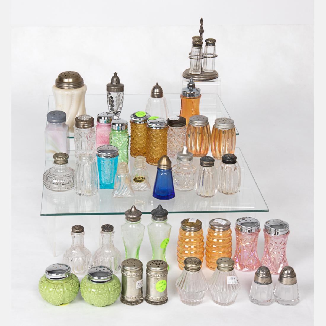 A Collection of Molded and Pressed, Colored, Clear and: A Collection of Molded and Pressed, Colored, Clear and Carnival Glass Shakers by Various Makers, 20th Century, Including pieces by Challenor, Terry Crider, Cambridge, Heisey Glass Co., L.G. Wright Gla