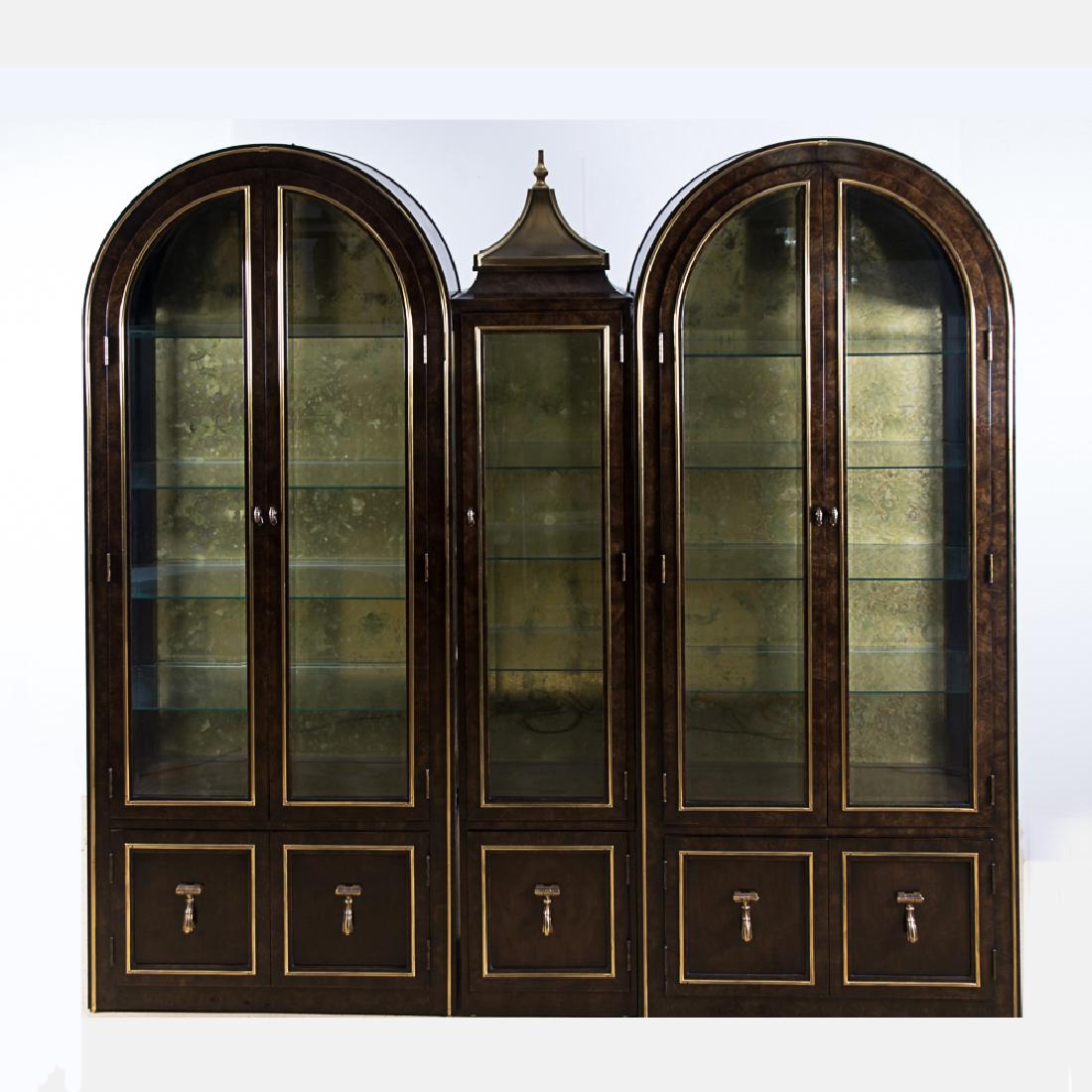 A Set of Three Bernhard Rohne for MasterCraft Burled: A Set of Three Bernhard Rohne for MasterCraft Burled Hardwood, Brass and Glass Display Cabinets, 20th Century, Three freestanding parts. Largest dimensions: h: 85 x w: 36 x d: 16 in.
