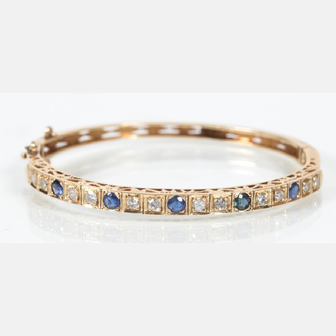 A 14kt. Yellow Gold, Diamond and Sapphire Bangle (1 of 4)