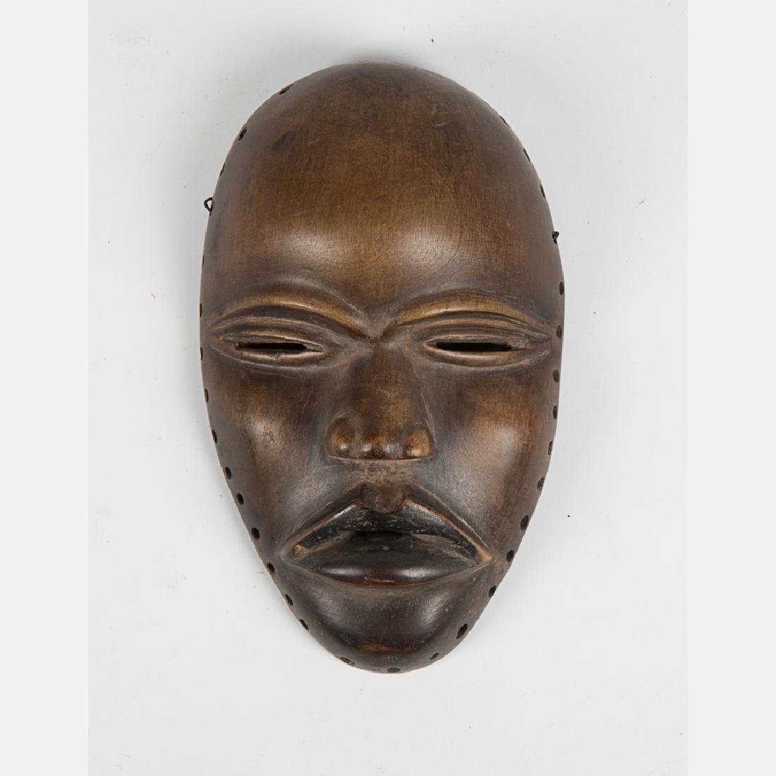 An African Dan Carved Hardwood Face Mask, Liberia, ca. (1 of 2)