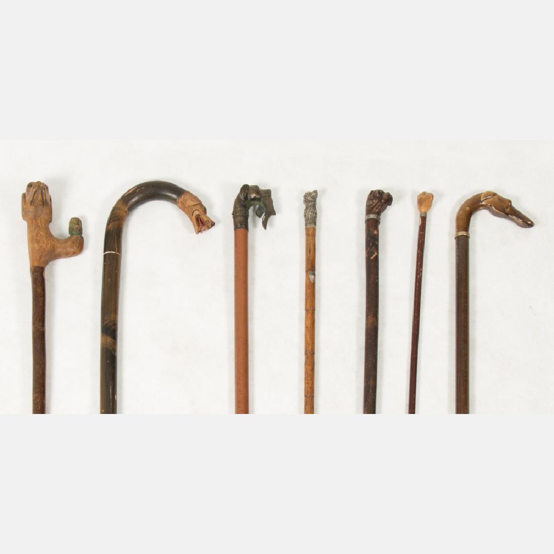 A Group of Seven Carved Wood, Metal, Celluloid and (1 of 19)