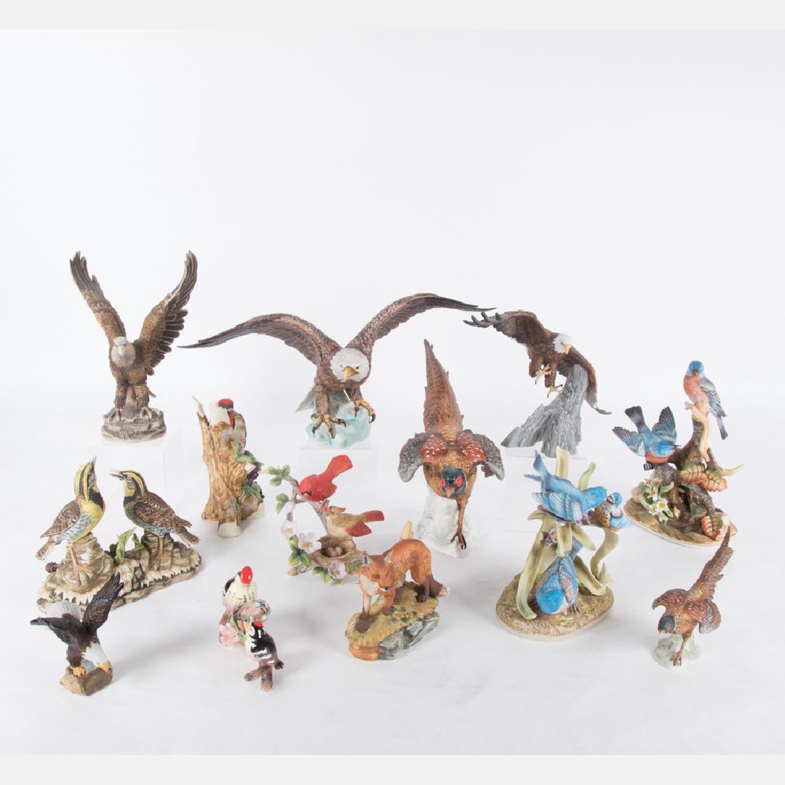 A Collection of Bisque Porcelain Bird and Animal Form: A Collection of Bisque Porcelain Bird and Animal Form Statuettes by Various Makers, 20th Century, Including pieces by Goebel and Sadek. Largest dimensions: h: 10 x w: 18 x d: 8 in.