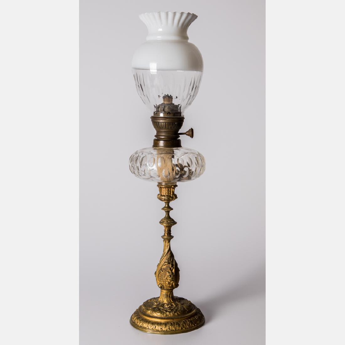 A French Brass and Etched Glass Oil Lamp by Fauvelle,: A French Brass and Etched Glass Oil Lamp by Fauvelle, 19th Century, Moderne 15. H: 24 1/2 D: 6 in. The Collection of Oliver and Joyce Murphy.