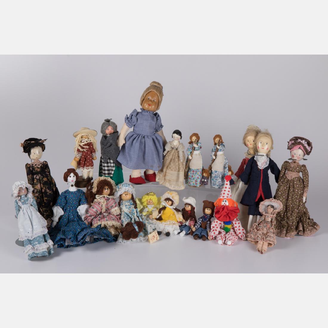 A Miscellaneous Collection of Painted Wood Dolls by (1 of 2)