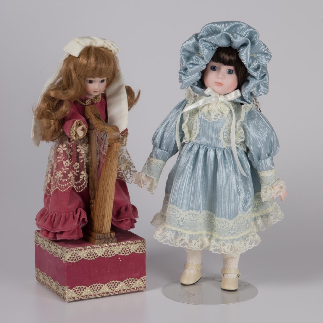 Two Bisque Music Dolls, 20th Century,: Two Bisque Music Dolls, 20th Century, Including an automaton harp player. The Collection of Oliver and Joyce Murphy.