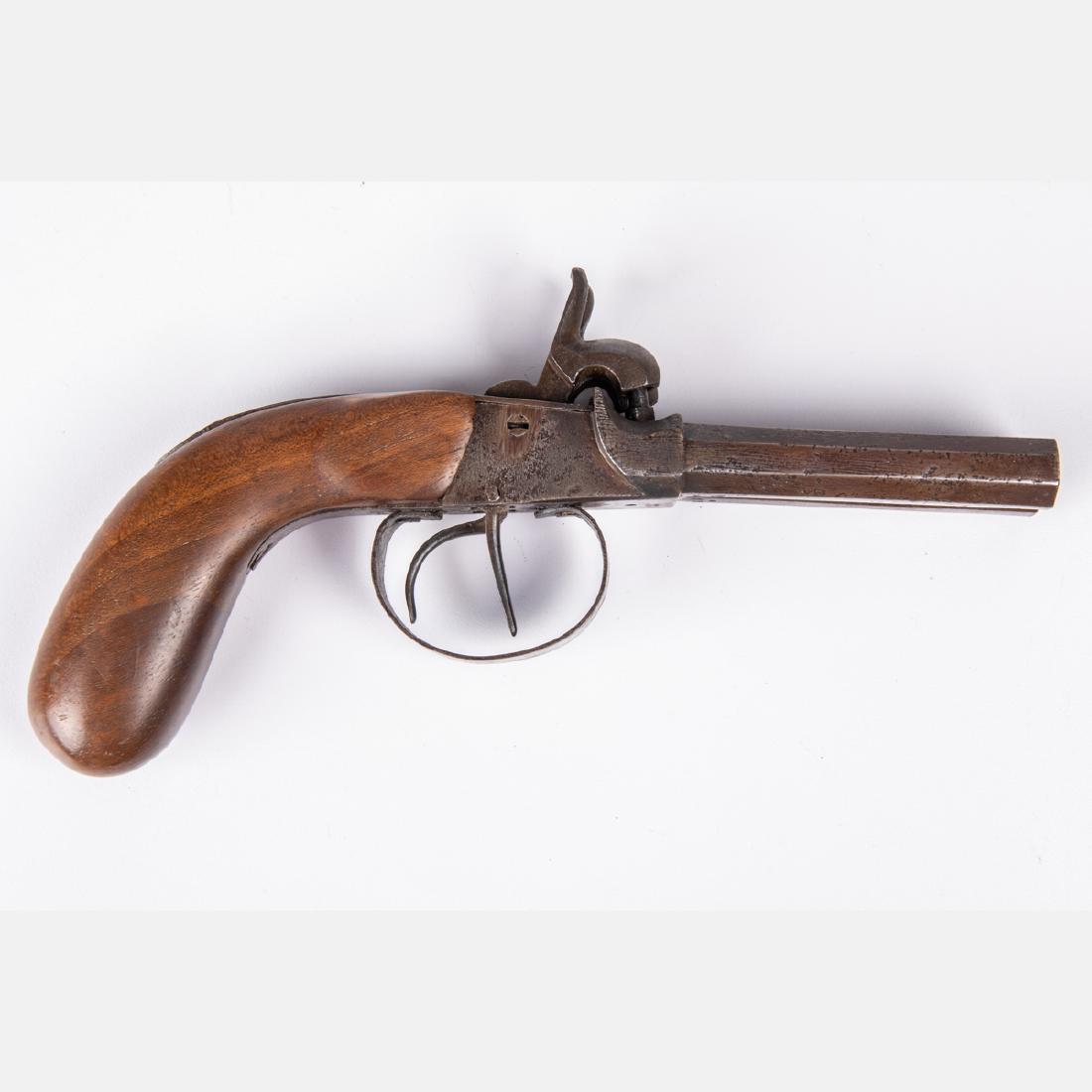 An Antique English Oak Double Barrel Percussion Pistol,