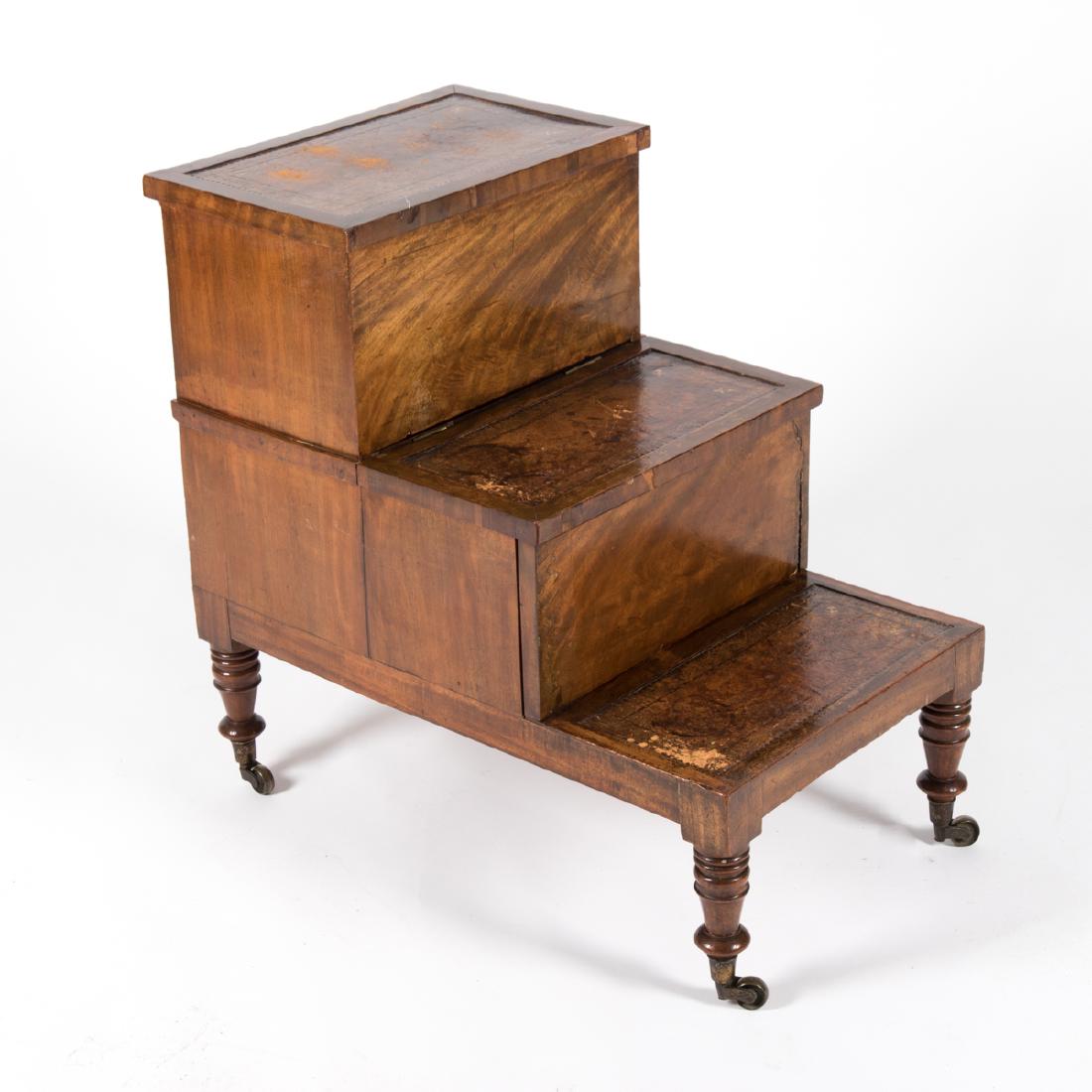 A Georgian Mahogany and Leather Combination Bed Step: A Georgian Mahogany and Leather Combination Bed Step and Commode, 19th Century. H: 27 1/2 W: 28 D: 17 3/4 in.