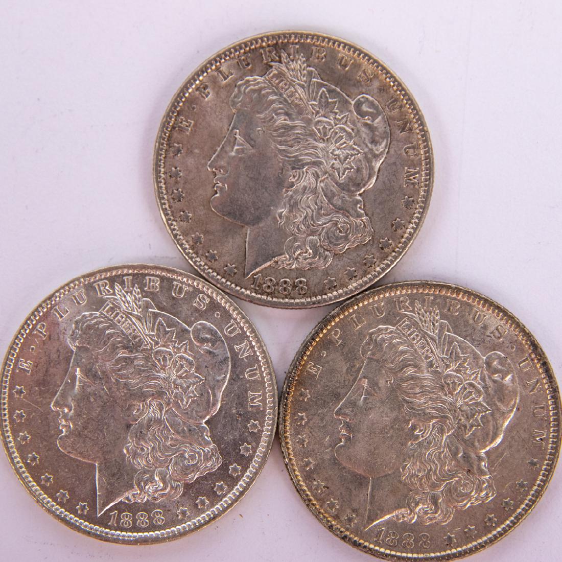 A Group of Three 1888-P Morgan Silver Dollars,: A Group of Three 1888-P Morgan Silver Dollars, Circulated.