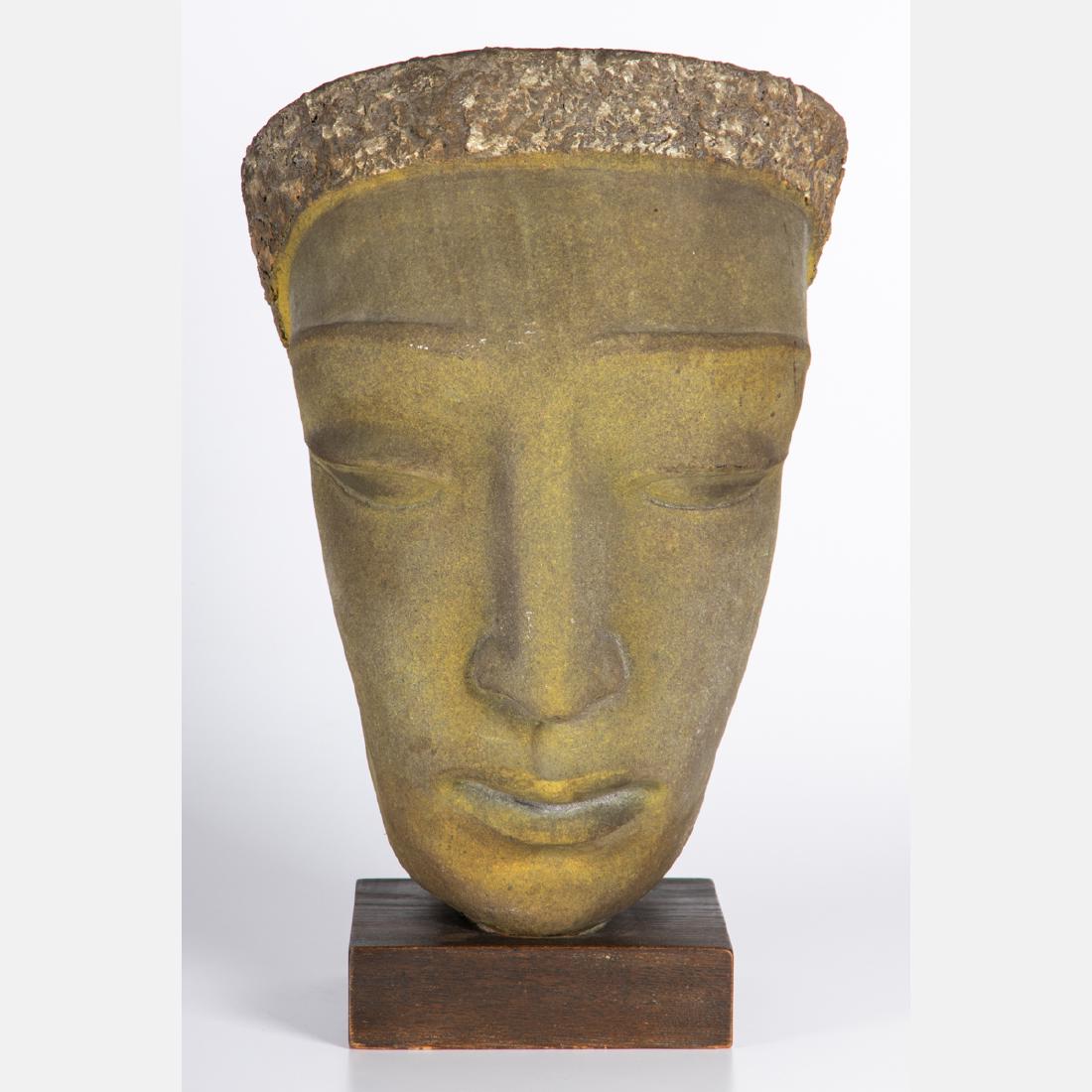 Edris Eckhardt (1905-1998) Head of a Woman Painted: Edris Eckhardt (1905-1998) Head of a Woman Painted terracotta, Signed at base. The sculpture is mounted to a base with three brass screws and plaster, possibly by the artist. H: 19 W: 11 7/8 in.