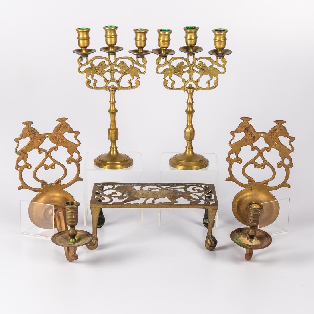 A Group of Brass Decorative Candlesticks, Sconces and: A Group of Brass Decorative Candlesticks, Sconces and Trivet, 19th/20th Century. Largest dimensions: h: 3 3/4 x w: 5 1/2 x d: 10 in.