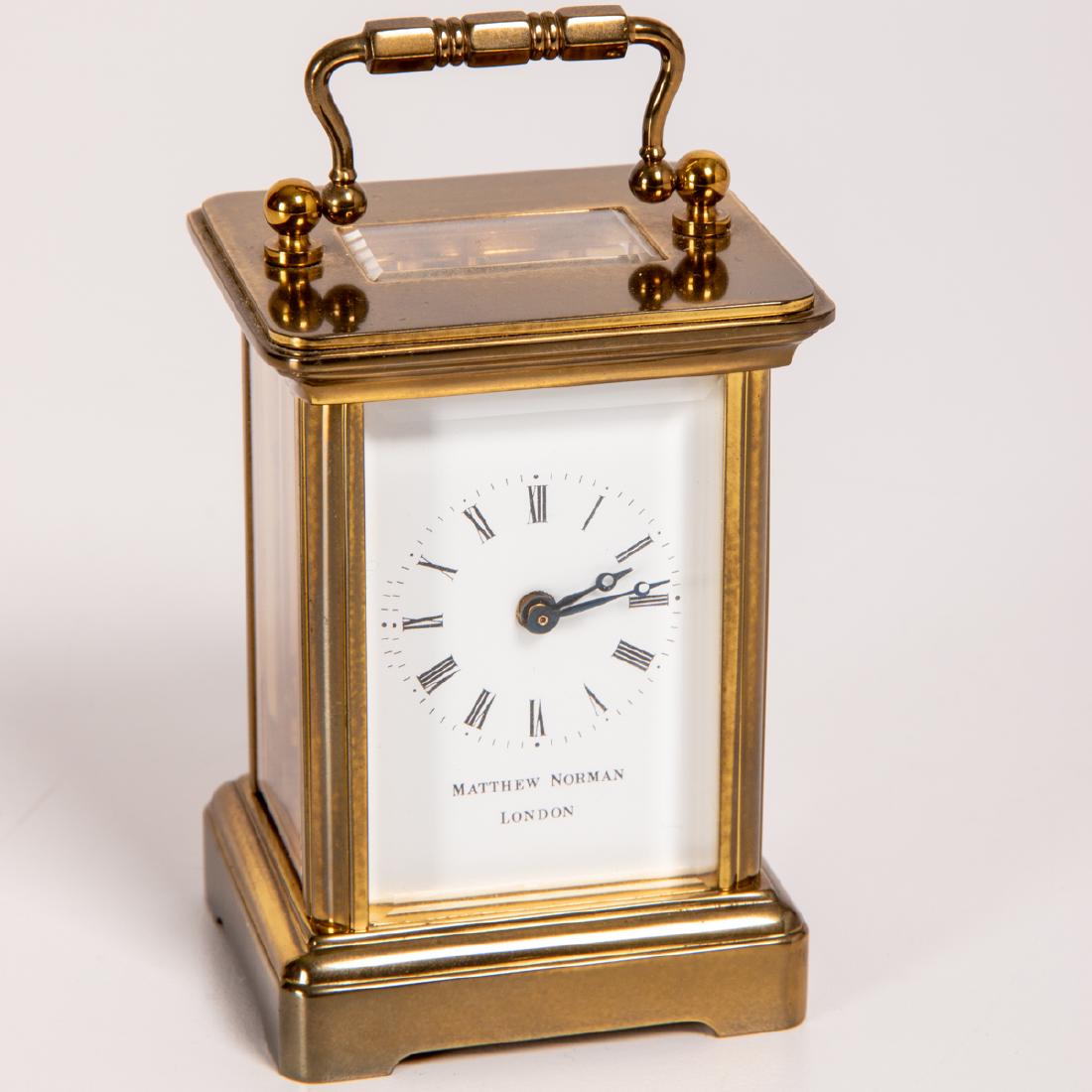 A Diminutive Brass Swiss Made Matthew Norman Carriage: A Diminutive Brass Swiss Made Matthew Norman Carriage Clock, London, 20th Century, Not in working order. H: 4 W: 2 D: 2 in.