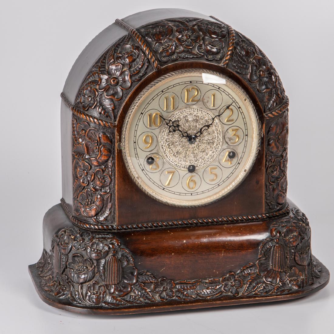 A Herman Miller Art Deco Table Clock, 20th Century,: A Herman Miller Art Deco Table Clock, 20th Century, Having a domed case with floral decoration, the dial with Arabic numerals. H: 14 in.