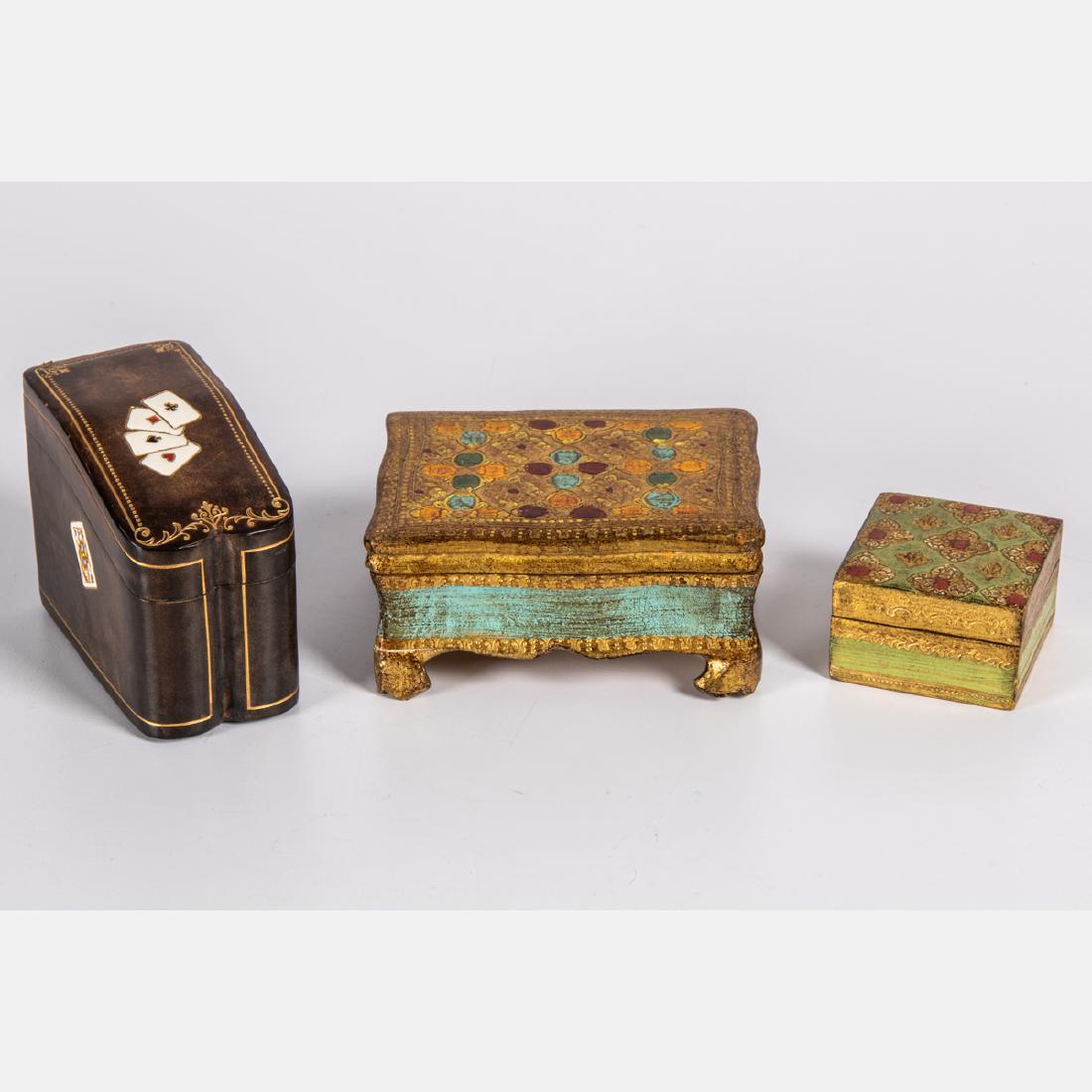 A Group of Four Florentine Gilt Painted and Tooled: A Group of Four Florentine Gilt Painted and Tooled Leather Wooden Boxes, 20th Century. Largest dimensions: h: 2 1/4 x w: 4 7/8 x d: 3 5/8 in.