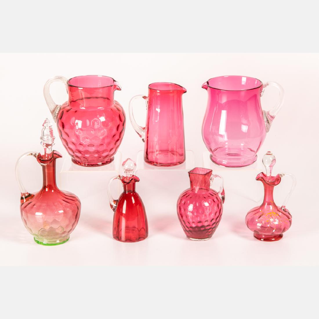 A Miscellaneous Collection of Blown Cranberry Glass: A Miscellaneous Collection of Blown Cranberry Glass Serving and Decorative Items, 19th/20th Century. Largest dimensions: h: 17 in.