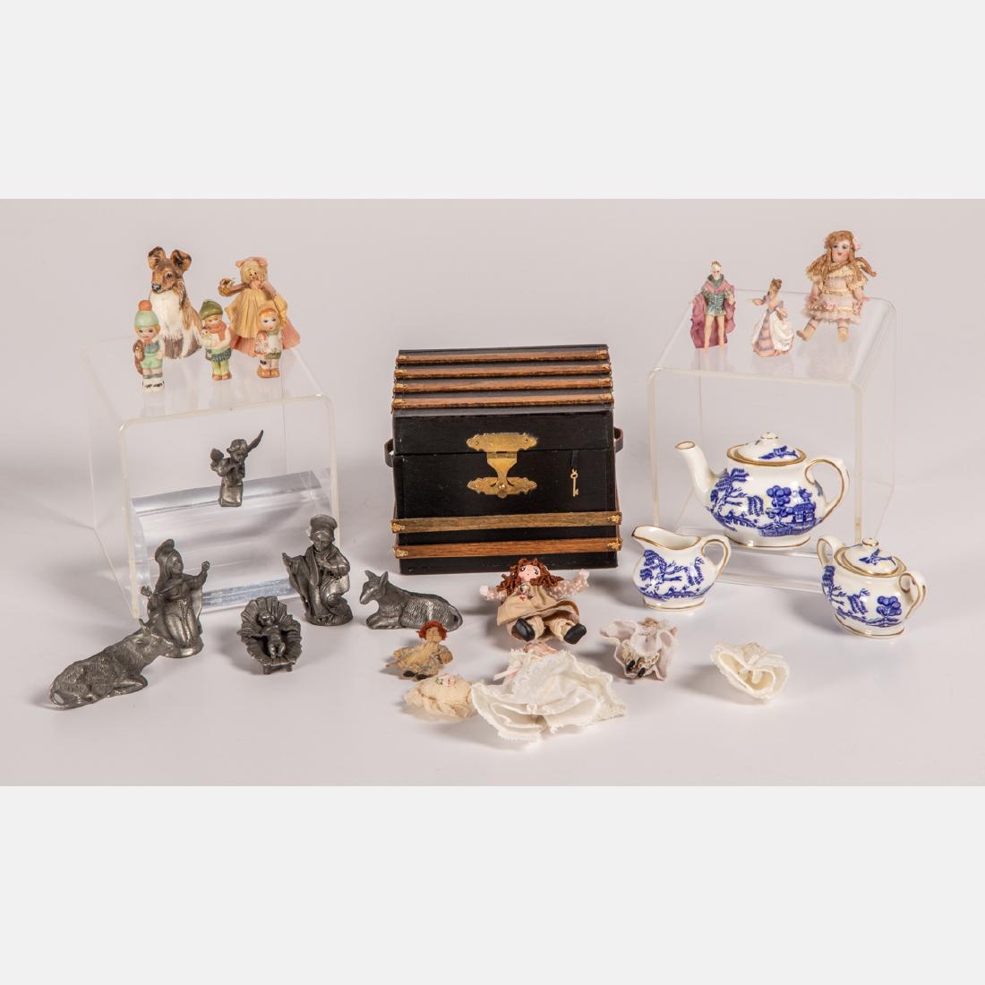 A Miscellaneous Collection of Doll House Accessories,: A Miscellaneous Collection of Doll House Accessories, 20th Century, Comprising of dolls, a Coalport porcelain Willow doll's tea set, doll trunk and pewter Nativity scene figures. Largest dimensions: h