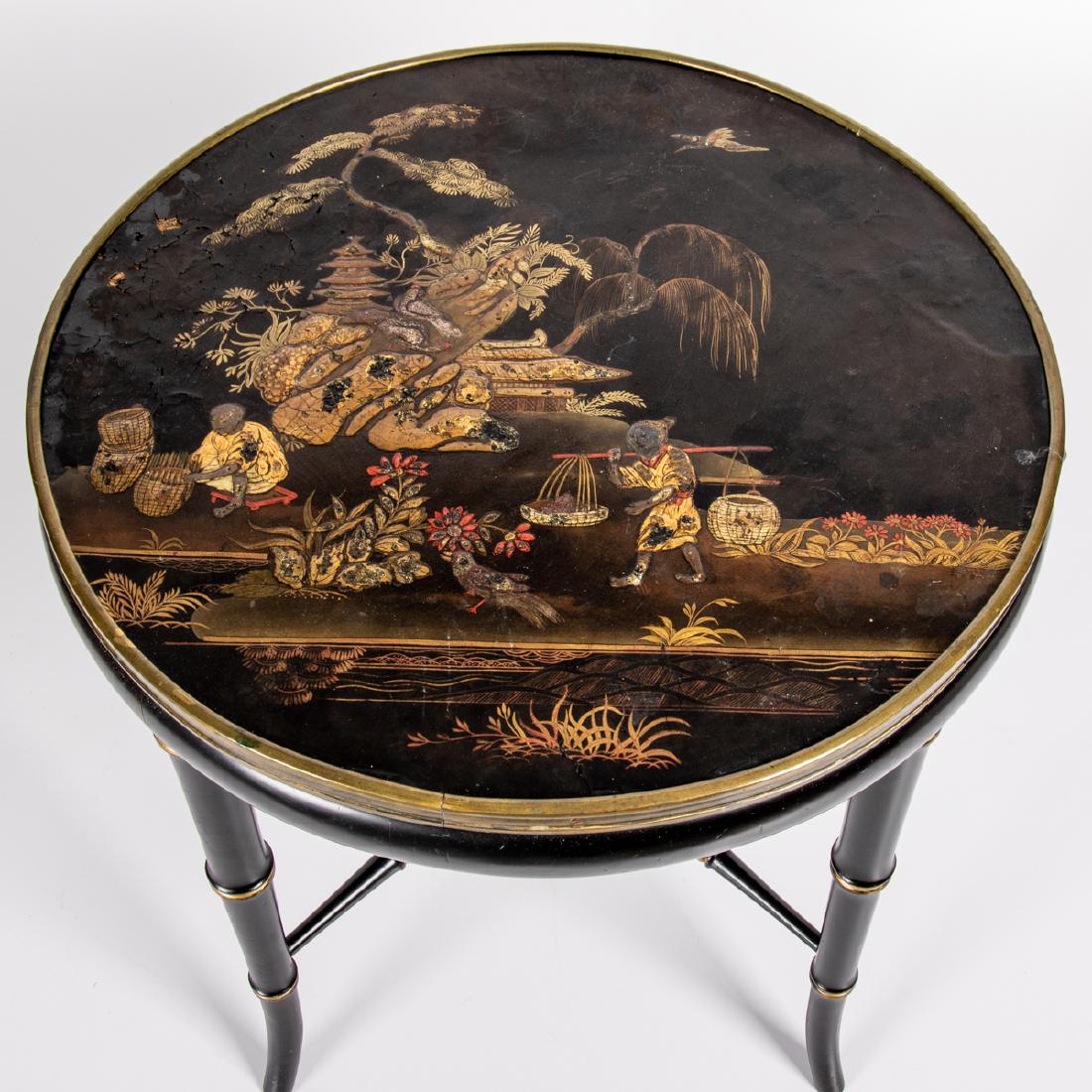 A Chinoiserie Lacquered Table, 20th Century,: A Chinoiserie Lacquered Table, 20th Century, Having a circular top decorated with figures in a landscape. H: 17 1/2 D: 18 1/2 in.