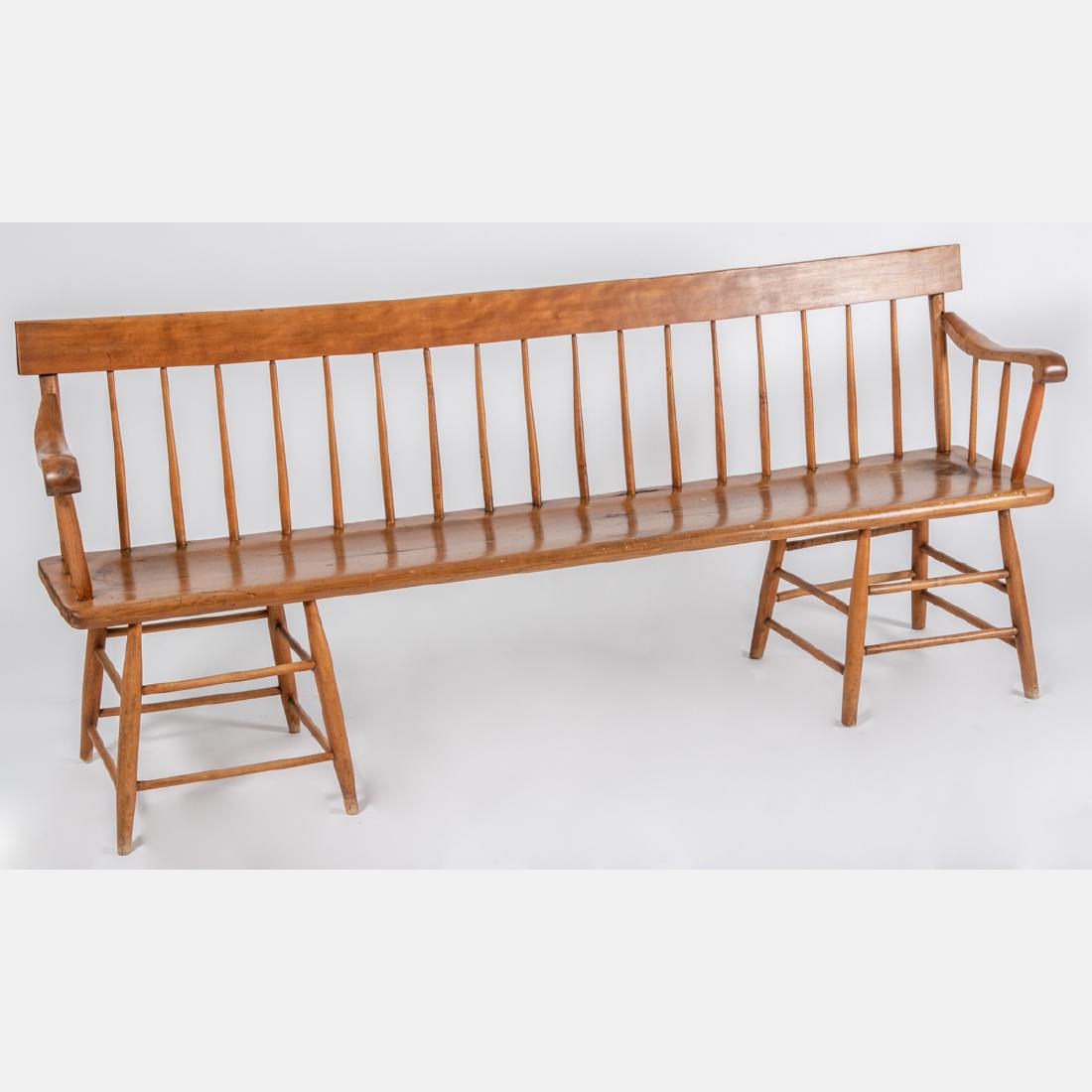 An American Spindle Back Bench, 19th/20th Century,: An American Spindle Back Bench, 19th/20th Century, With plank seat and turned legs joined by stretchers. W: 72 1/2 in.
