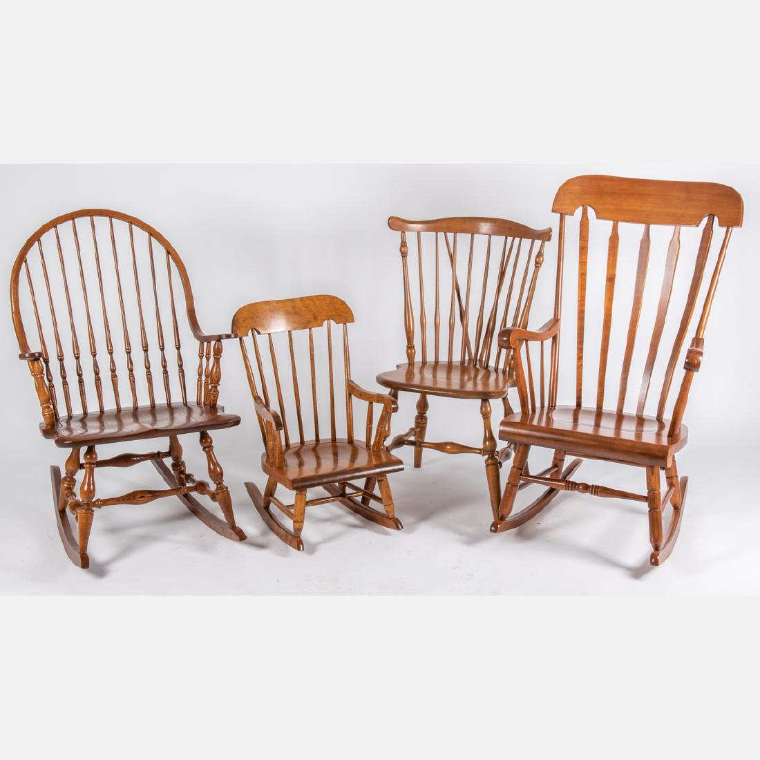 A Group of Three American Windsor Style Oak and Cherry: A Group of Three American Windsor Style Oak and Cherry Rocking Chairs and Side Chair, 20th Century, Together with an American rocking chair. Largest dimensions: h: 43 x w: 23 x d: 27 in.