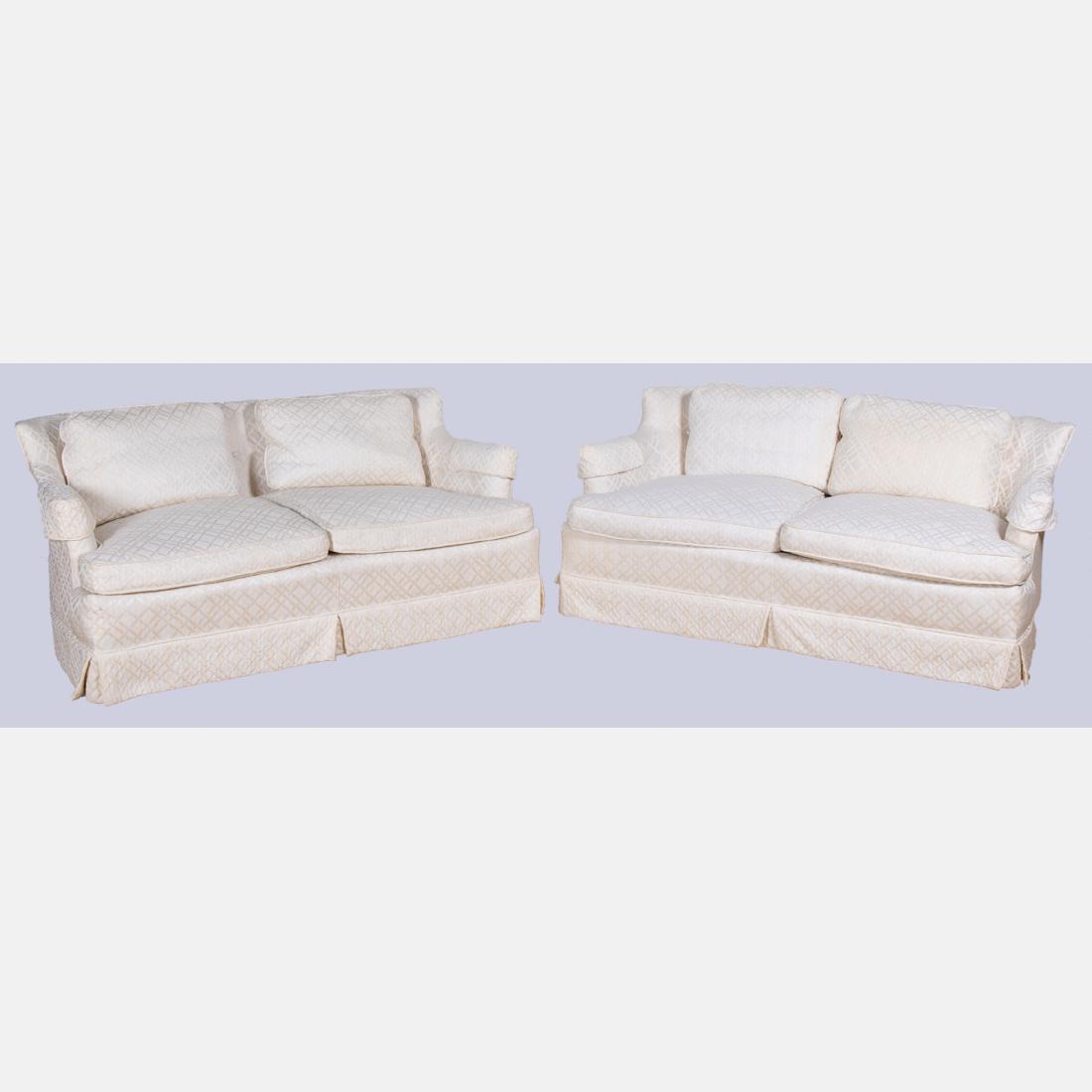 A Pair of White Upholstered Settees, 20th Century.: A Pair of White Upholstered Settees, 20th Century. H: 28 W: 60 D: 29 in.