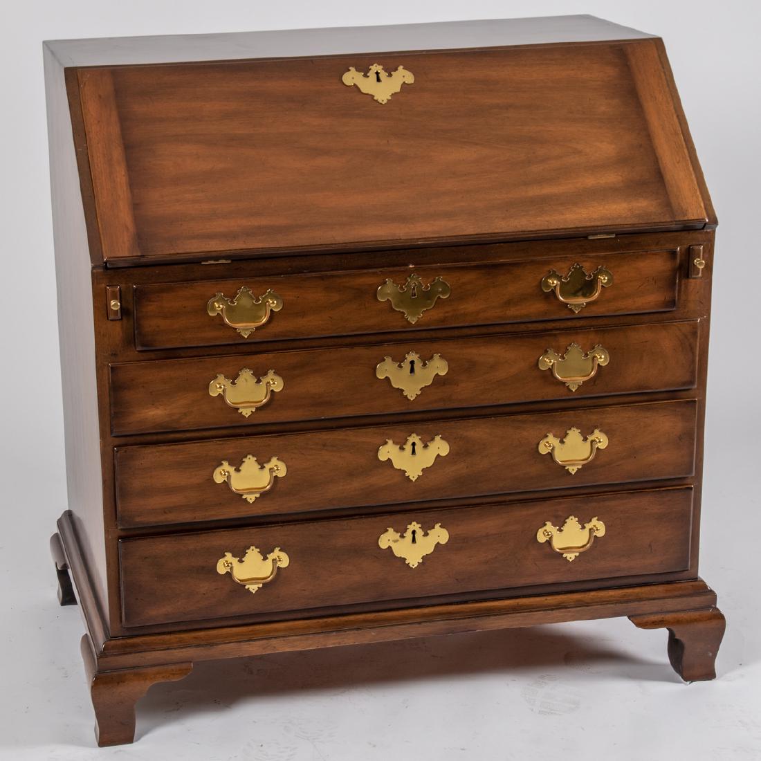 A Kittinger Georgian Style Mahogany Slant Front Desk,: A Kittinger Georgian Style Mahogany Slant Front Desk, 20th Century, Having a rectangular top over the fall front writing surface opening to a fitted interior above four graduated drawers, the whole ra