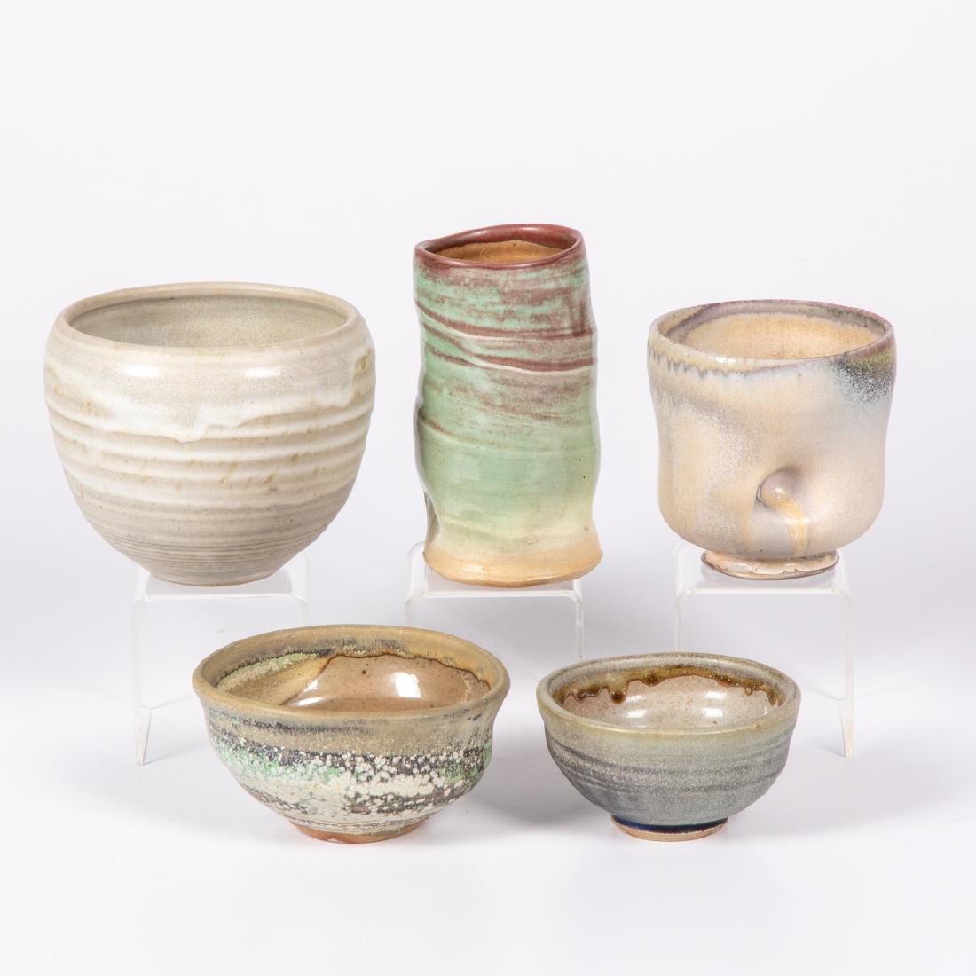 Cheryl Glaser (20th Century) A Group of Five Bowls and: Cheryl Glaser (20th Century) A Group of Five Bowls and Vase, Raku ceramic, Four initialed. Largest dimensions: h: 4 3/4 x dia: 6 in. From the collection of George Roby (1936-2017).