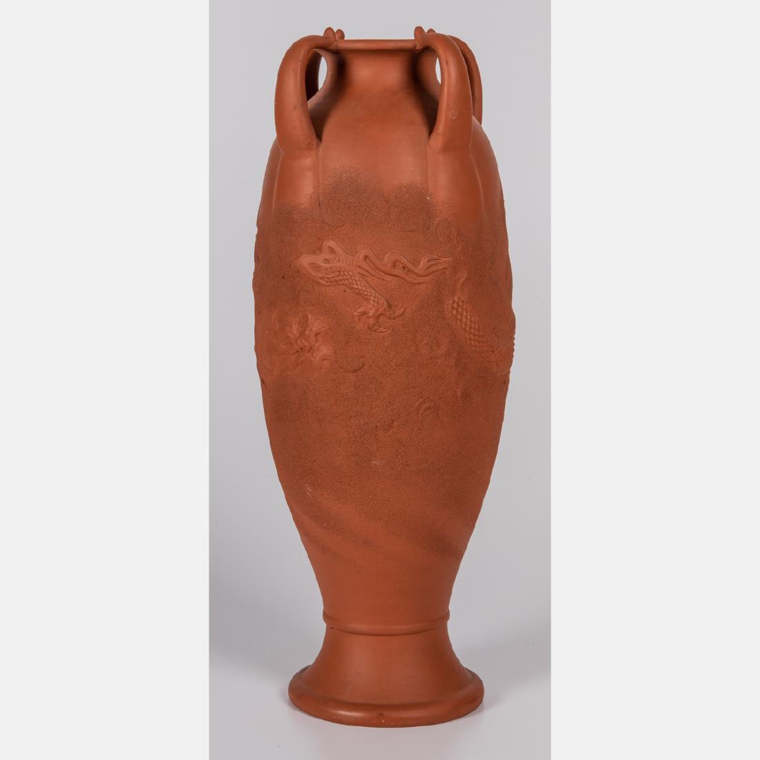 A Japanese Tokoname Redware Vase with Dragon Form: A Japanese Tokoname Redware Vase with Dragon Form Decoration, 20th Century, Having four applied handles. Signed on bottom. H: 18 1/4 D: 7 1/8 in.