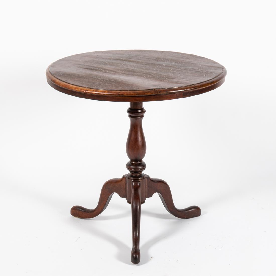A Queen Anne Style Mahogany Circular Tea Table by the: A Queen Anne Style Mahogany Circular Tea Table by the Wolverine Furniture Company, 19th Century. H: 29 5/8 D: 30 in.