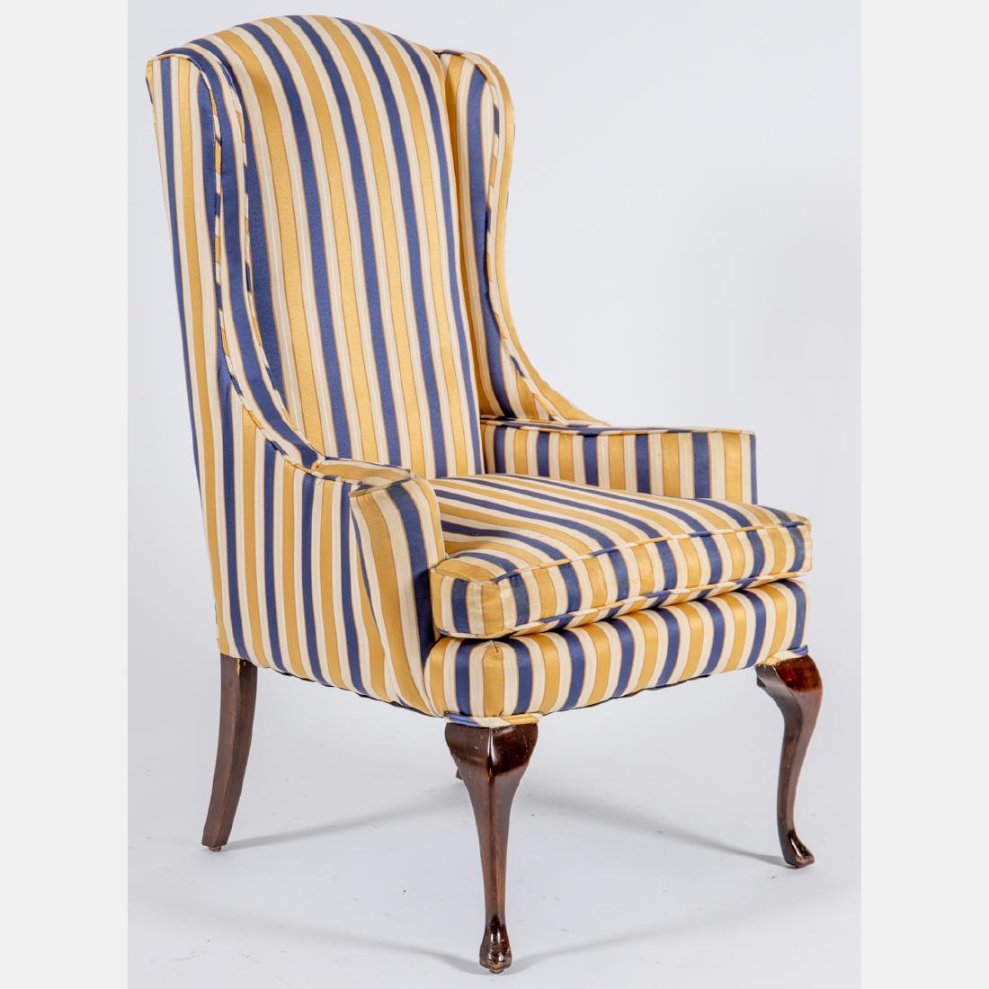 A Queen Anne Style Wingback Armchair, 20th Century,: A Queen Anne Style Wingback Armchair, 20th Century, Having silk upholstered back, arms and seat, raised on cabriole legs. H: 45 in.
