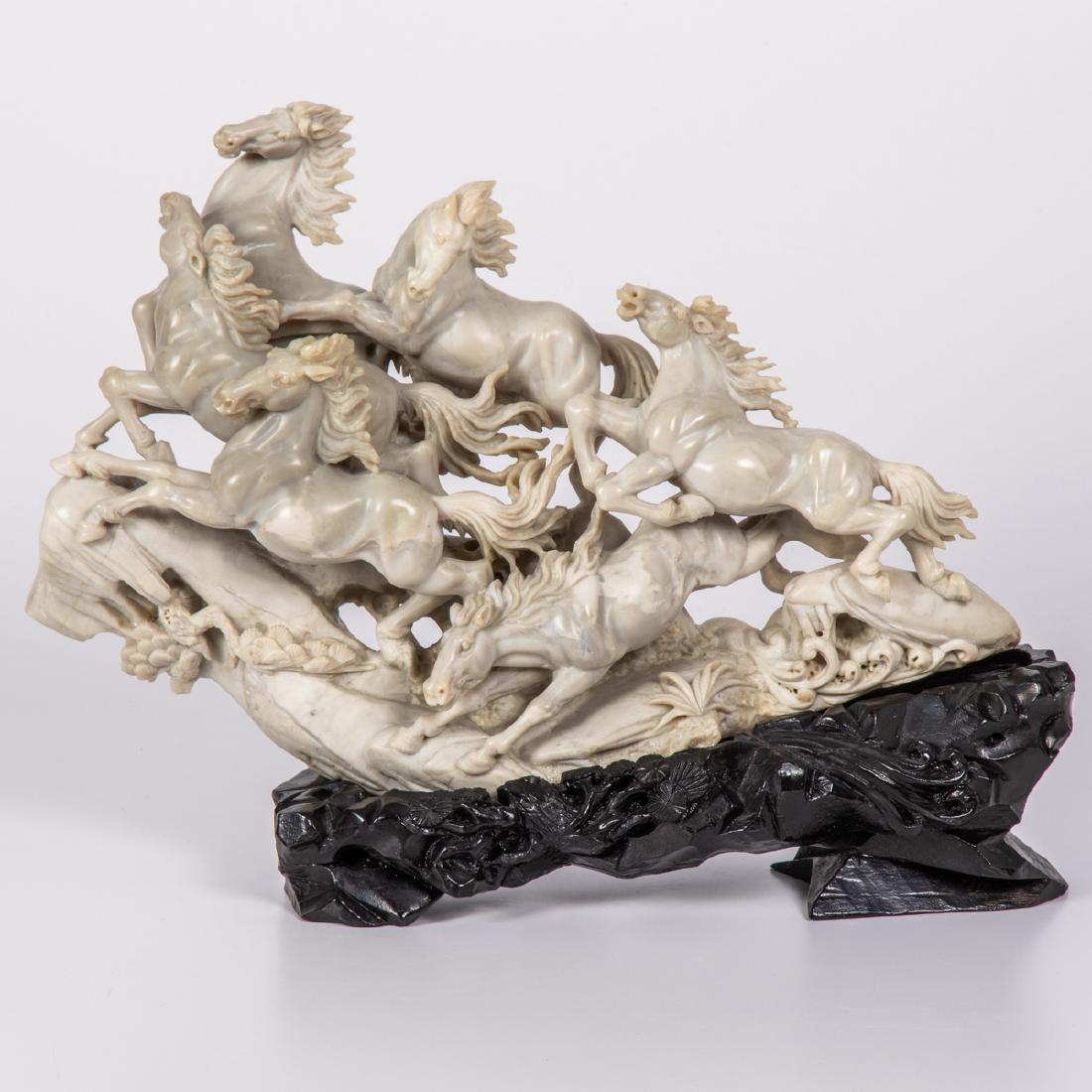 A Chinese Carved Soapstone Horse Figural Group on: A Chinese Carved Soapstone Horse Figural Group on Stand, 20th Century. H: 12 1/2 W: 17 1/4 D: 4 1/2 in.