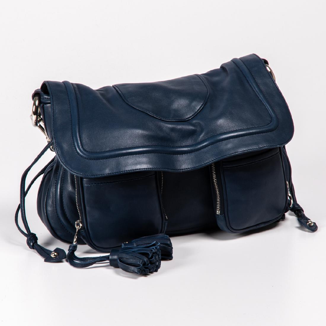 A Marc Jacobs Leather Top Handle Handbag, 20th Century,: A Marc Jacobs Leather Top Handle Handbag, 20th Century, In blue leather with flap-closure, two front pockets and tassel decorations. Small to medium size. H: 15 W: 15 D: 4 1/2 in.