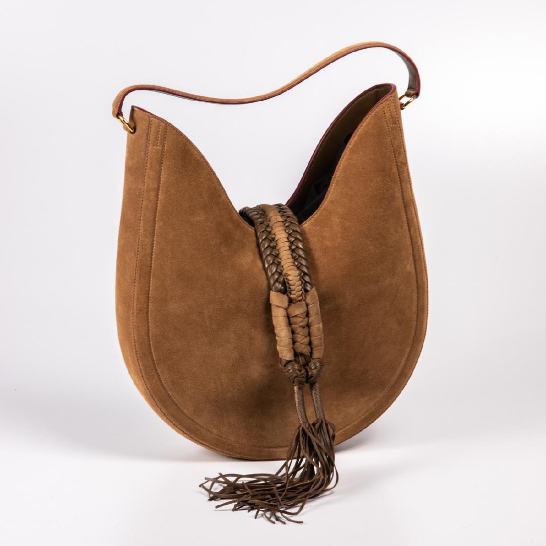 An Altuzarra Suede Ghianda Large Knot Hobo Bag, 20th: An Altuzarra Suede Ghianda Large Knot Hobo Bag, 20th Century, In light brown with flap-magnetic closure and flat strap. H: 17 W: 11 D: 3 in.