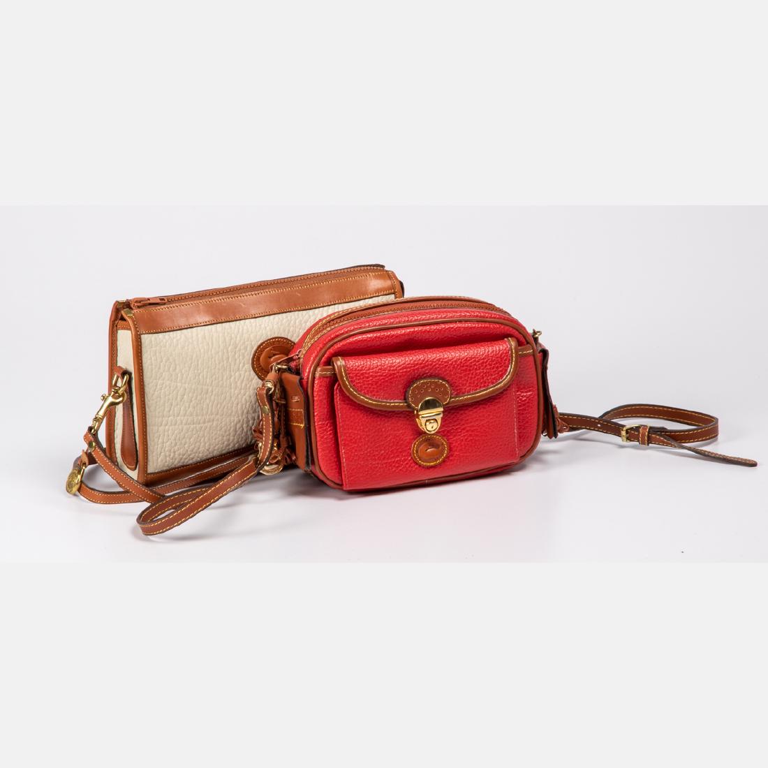 Two Dooney & Burke All Weather Leather Crossbody: Two Dooney & Burke All Weather Leather Crossbody Handbags, 20th Century, Both small in size with brown detachable crossbody straps. Largest dimensions: h: 7 x w: 11 x d: 3 in.