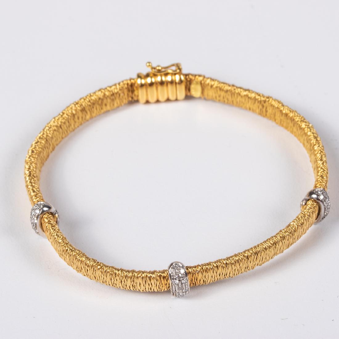 An 18kt. Yellow and White Gold, Diamond Bracelet,: An 18kt. Yellow and White Gold, Diamond Bracelet, Set with approx. thirty-nine round brilliant cut diamond melee, approx. 0.01pts each. Marked 18kt, Italy. Total approx. weight: 7.3 dwt. Please note n