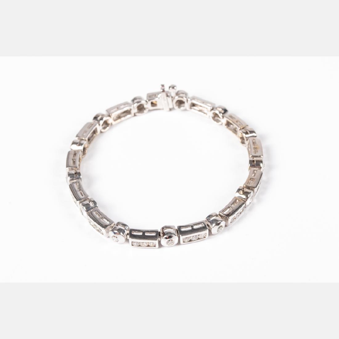 A 14kt. White Gold and Diamond Bracelet,: A 14kt. White Gold and Diamond Bracelet, Set with fifty-two round brilliant cut diamonds, thirteen each approx. 10pts., thirty-nine each approx. 0.06pts. Bracelet width 5mm. Marked 14k. Total approx. 
