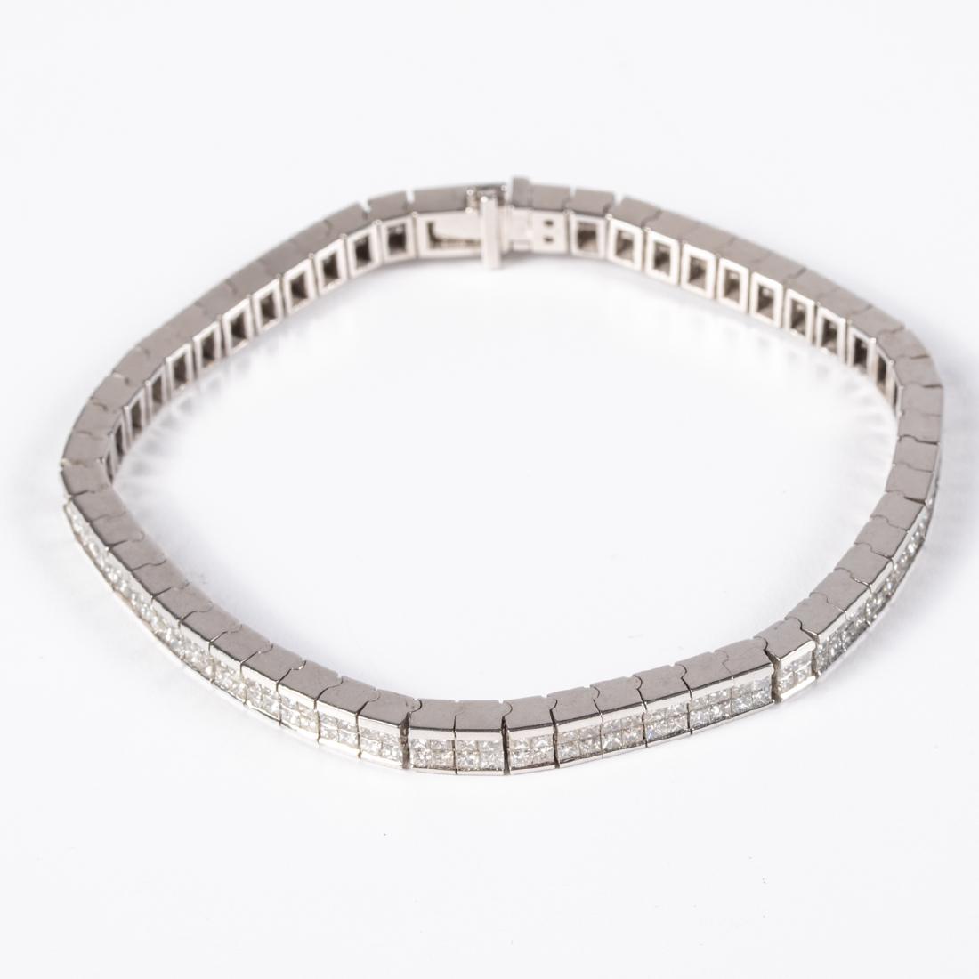 An 18kt. White Gold and Diamond Bracelet,: An 18kt. White Gold and Diamond Bracelet, Set with approx. 228 square cut diamonds, each approx. 0.04pts. with a SI-1/SI-2 clarity and G-H color. Bracelet width 4.85mm. Unmarked. Total approx. weight: