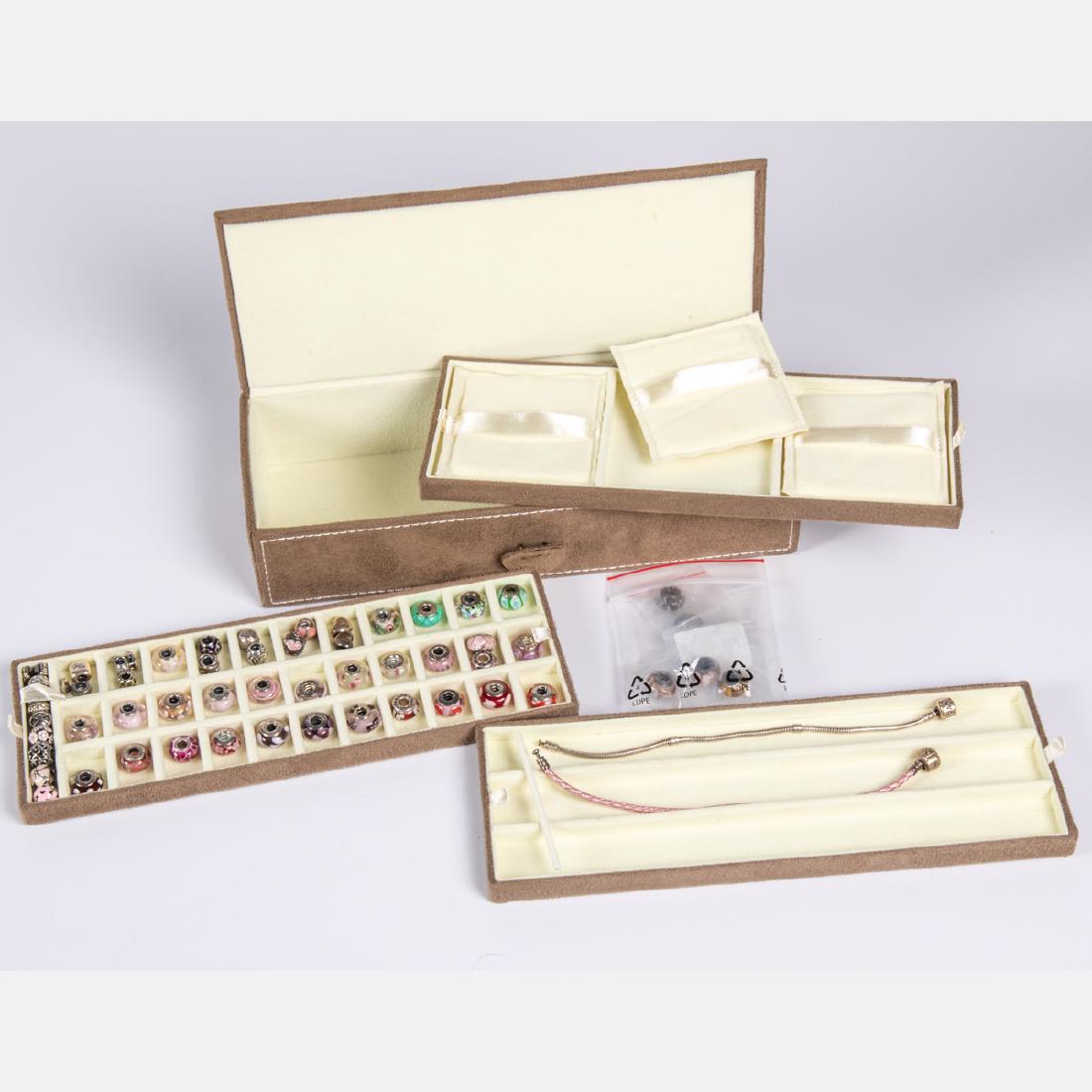 A Set of Pandora Charm Beads with Two Bracelets and: A Set of Pandora Charm Beads with Two Bracelets and Box, Including fifty-five charm beads of silver, sterling silver and glass. Please note no credit card payments for first time buyers and seven busi